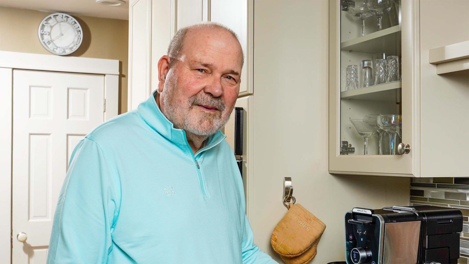 Robert smiling in kitchen.